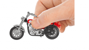 adult-hand-with-motorcycle-toy