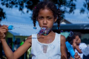 Child-blowing-bubbles